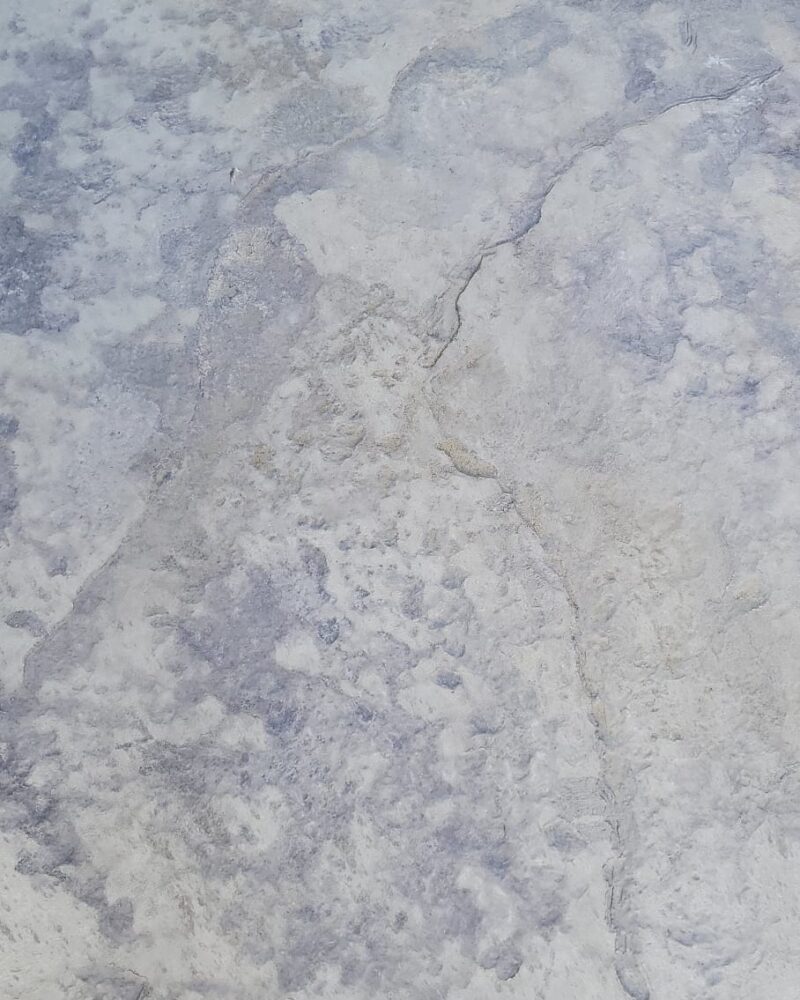 A patio deck showing signs of wear and faded color