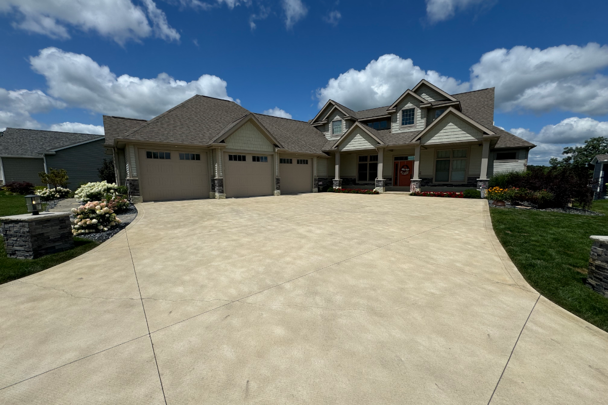 fter photo of large scored and broom-finished driveway stained with Buff Antiquing™ Stain and sealed with EasySeal™ Satin, showing a smooth and refreshed finish.