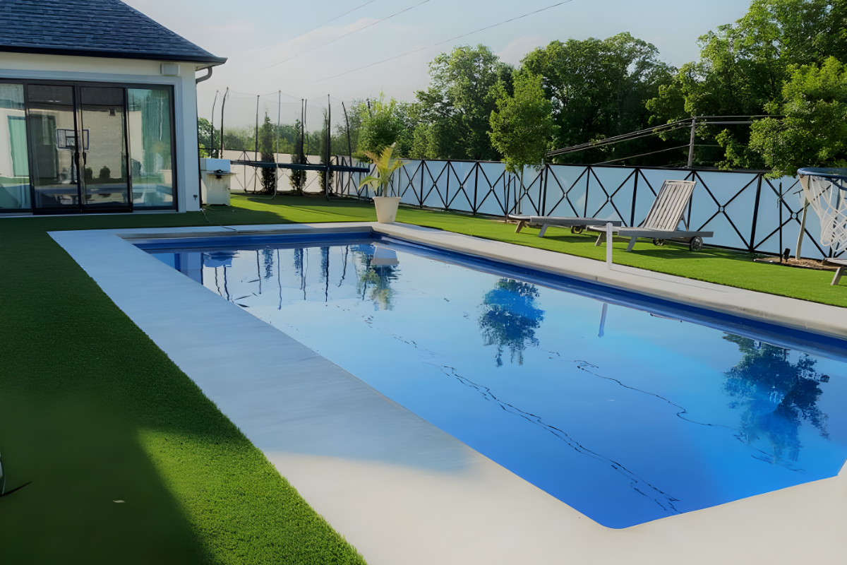 Broom-finished concrete pool deck stained with Buff EasyTint™ for a clean, natural look.