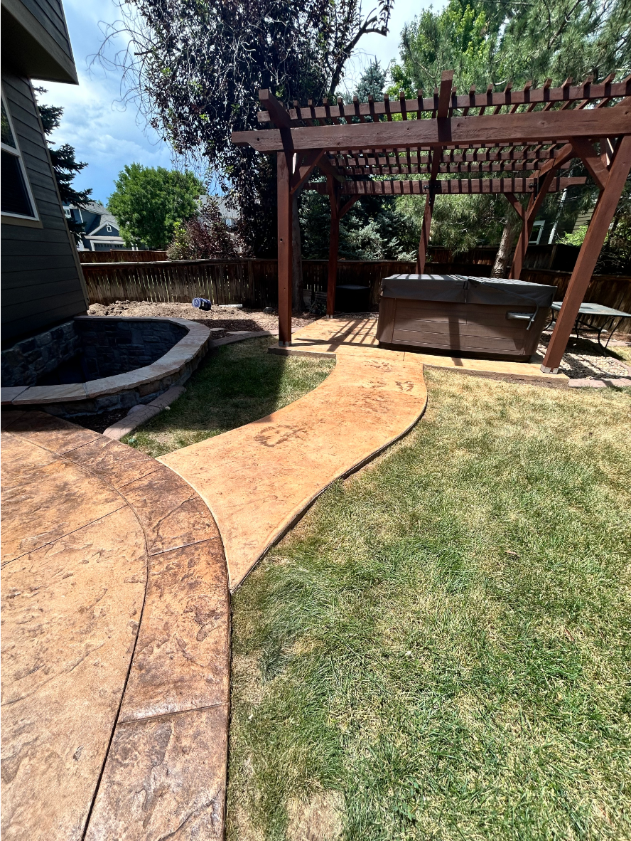 Outdoor living area and stamped patio refinished in Café Royale