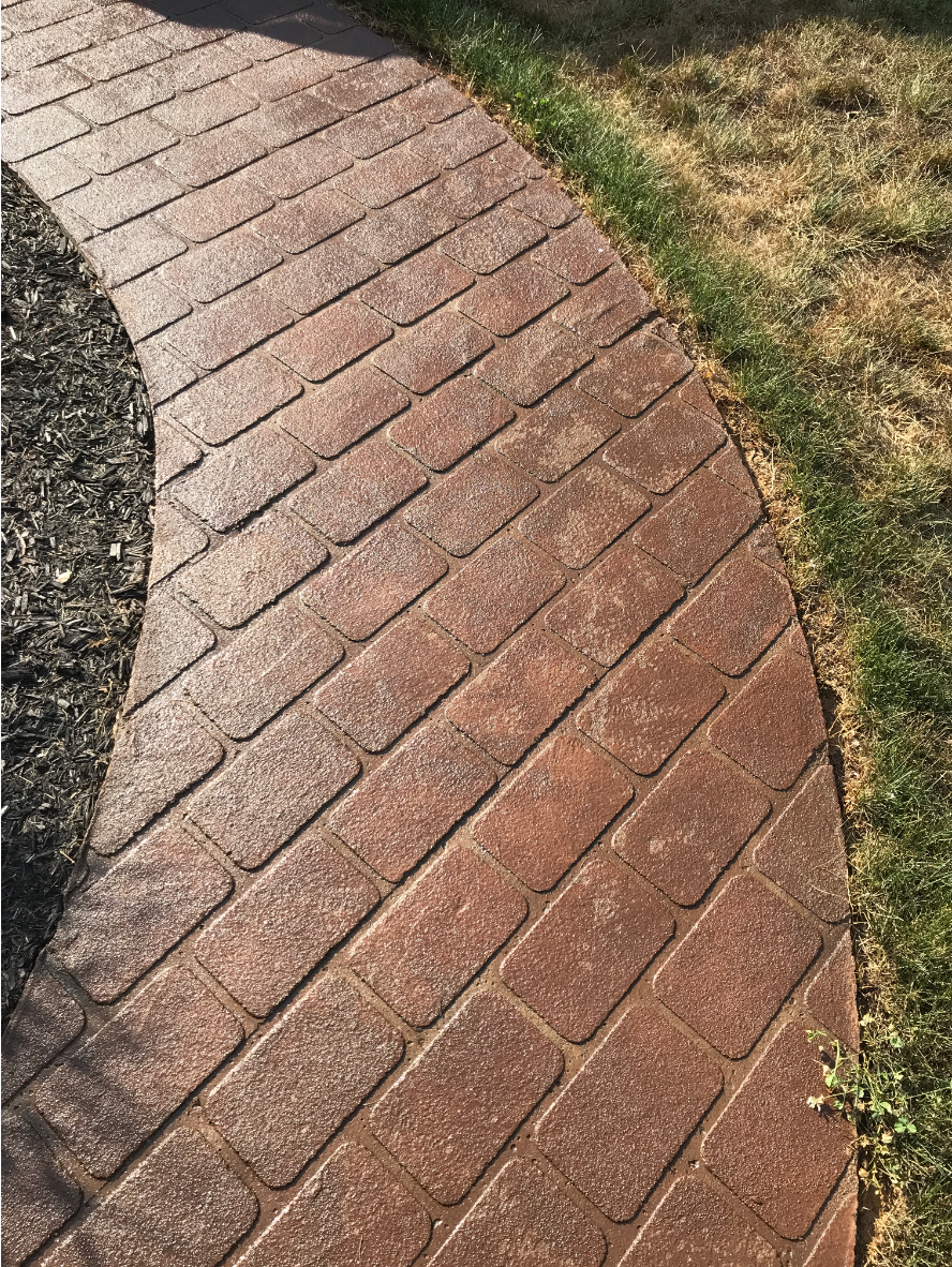 Paver walkway refreshed with Café Royale Portico™ Paver Stain, showcasing rich brown tones and a smooth sealed finish.