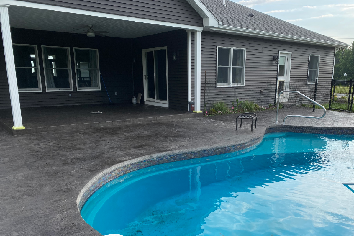 Stamped concrete pool deck stained with Black Antiquing