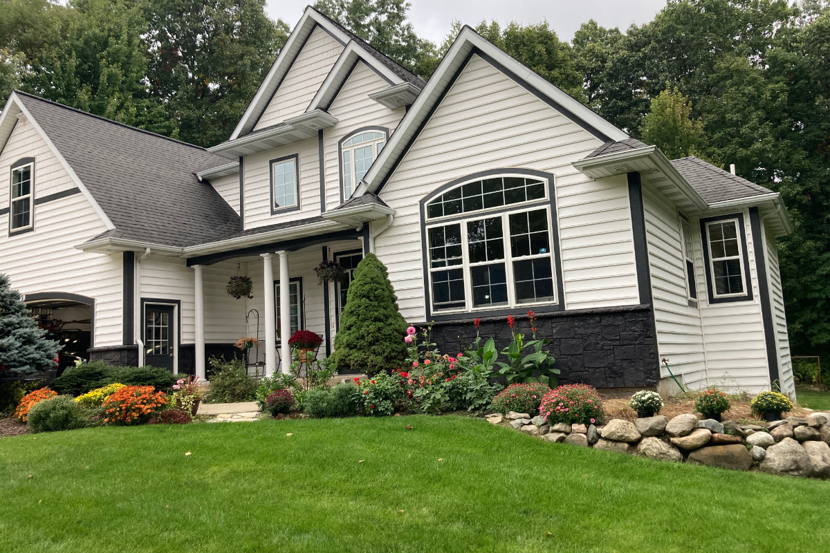 Full view of the house showcasing its finished Black Portico™ stained stone facade transformation