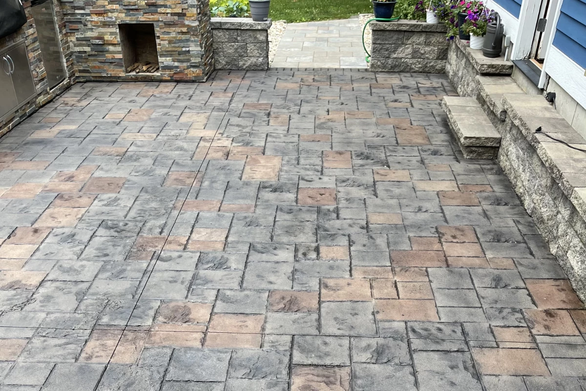 Restored stamped concrete patio stained with Auburn and Light Charcoal Antiquing Stains, finished with satin EasySeal sealer.