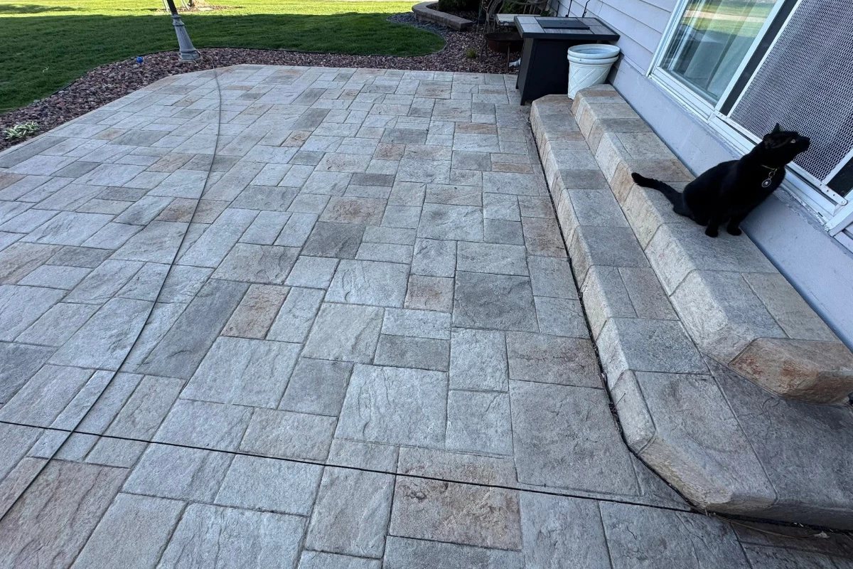 20 year old faded decorative concrete stamped patio