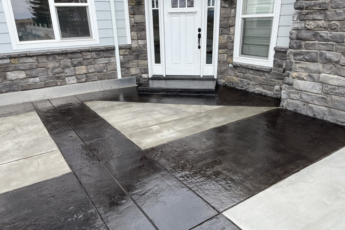 scored concrete front porch stained with black EasyTint tinted sealer in a high gloss finish.