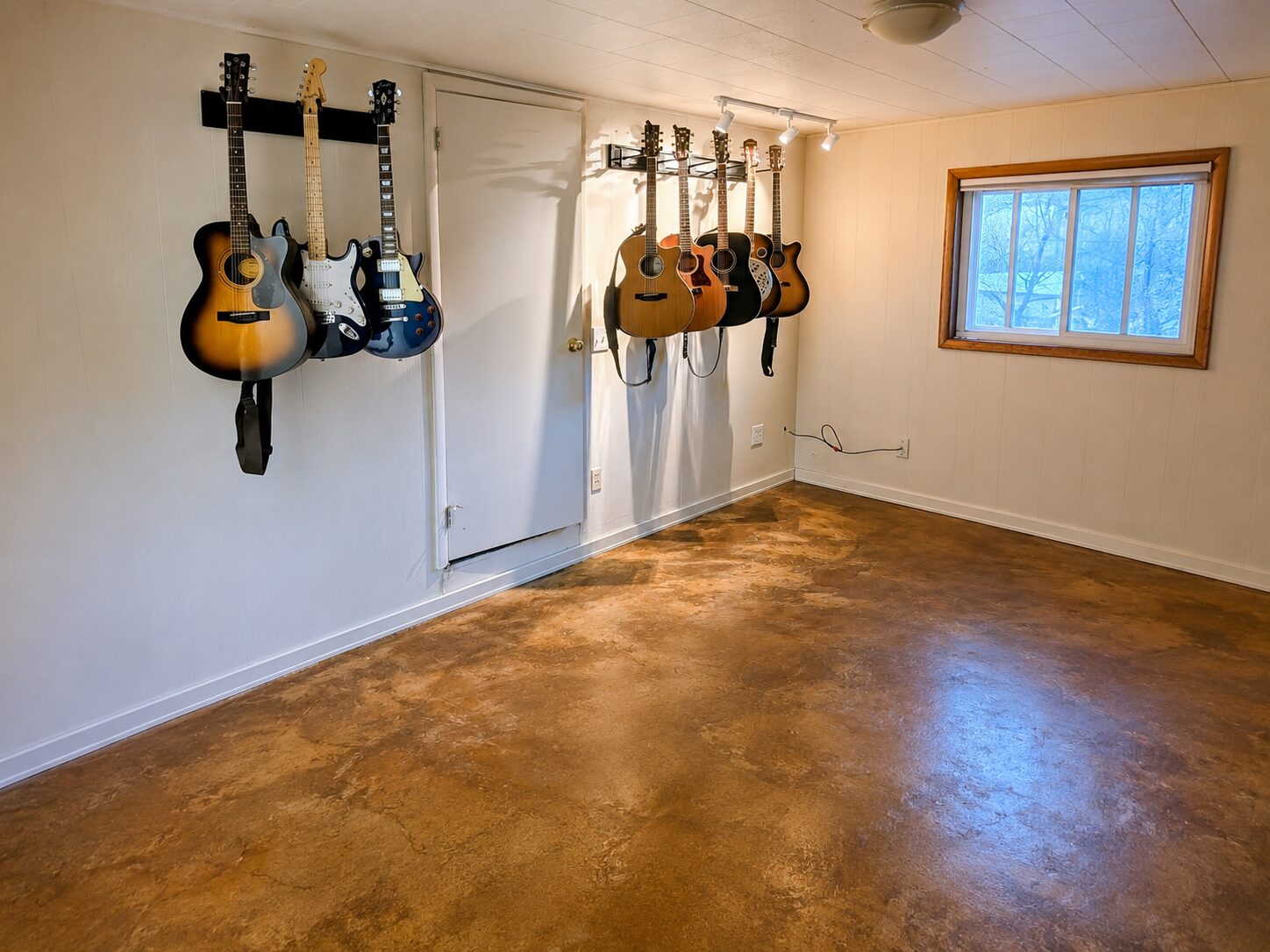Converted garage concrete floor finished with ColorWave Amber and AcquaSeal Satin.